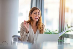 Woman at pc smiling