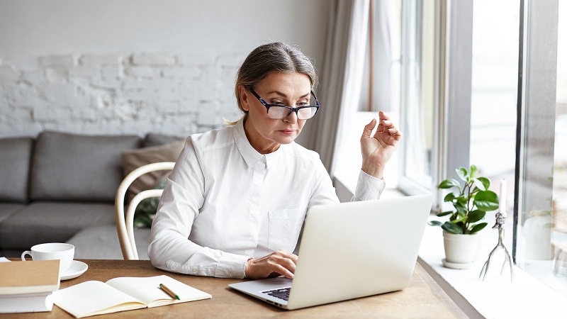 Woman senior on laptop